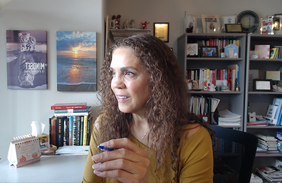 Suha Beidas Zehl, CMB®, AMSP™ working at her desk in her home office